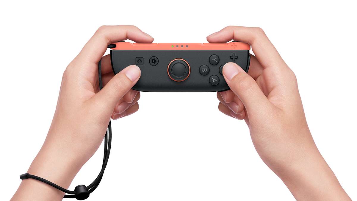 Nintendo Switch 2 Joy-Con 2 Right Light Red in use with wrist strap