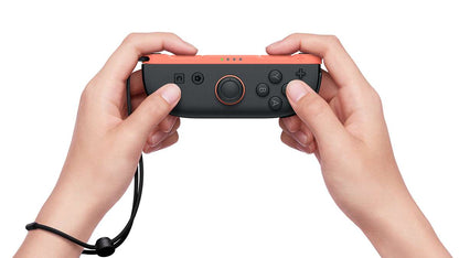 Nintendo Switch 2 Joy-Con 2 Right Light Red in use with wrist strap
